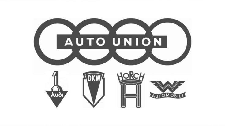 Auto Union logo, 4 karika felirattal, alatta a kezdeti 4 cég emblémája